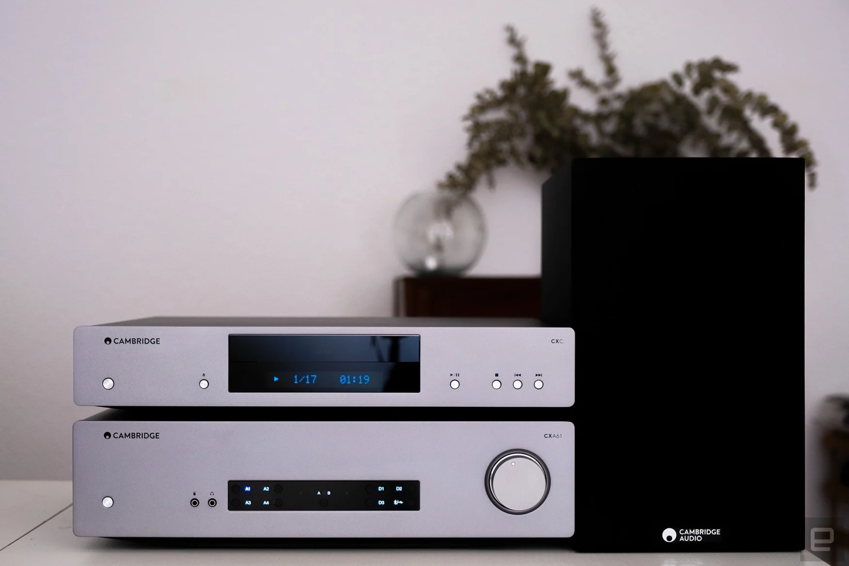 A HiFi separates amp and CD player are pictured next to a speaker.