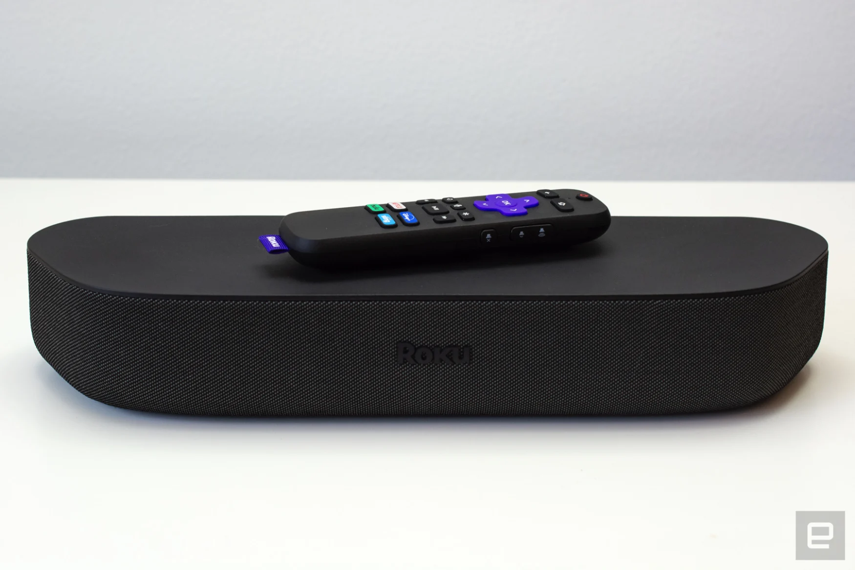 Roku Streambar speakers on a white table.