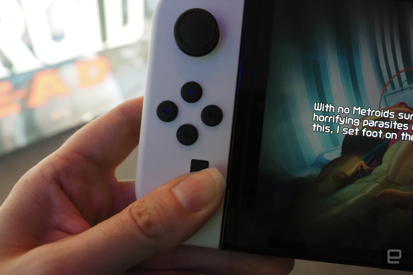 Left Joy-Con with screen and hand visible