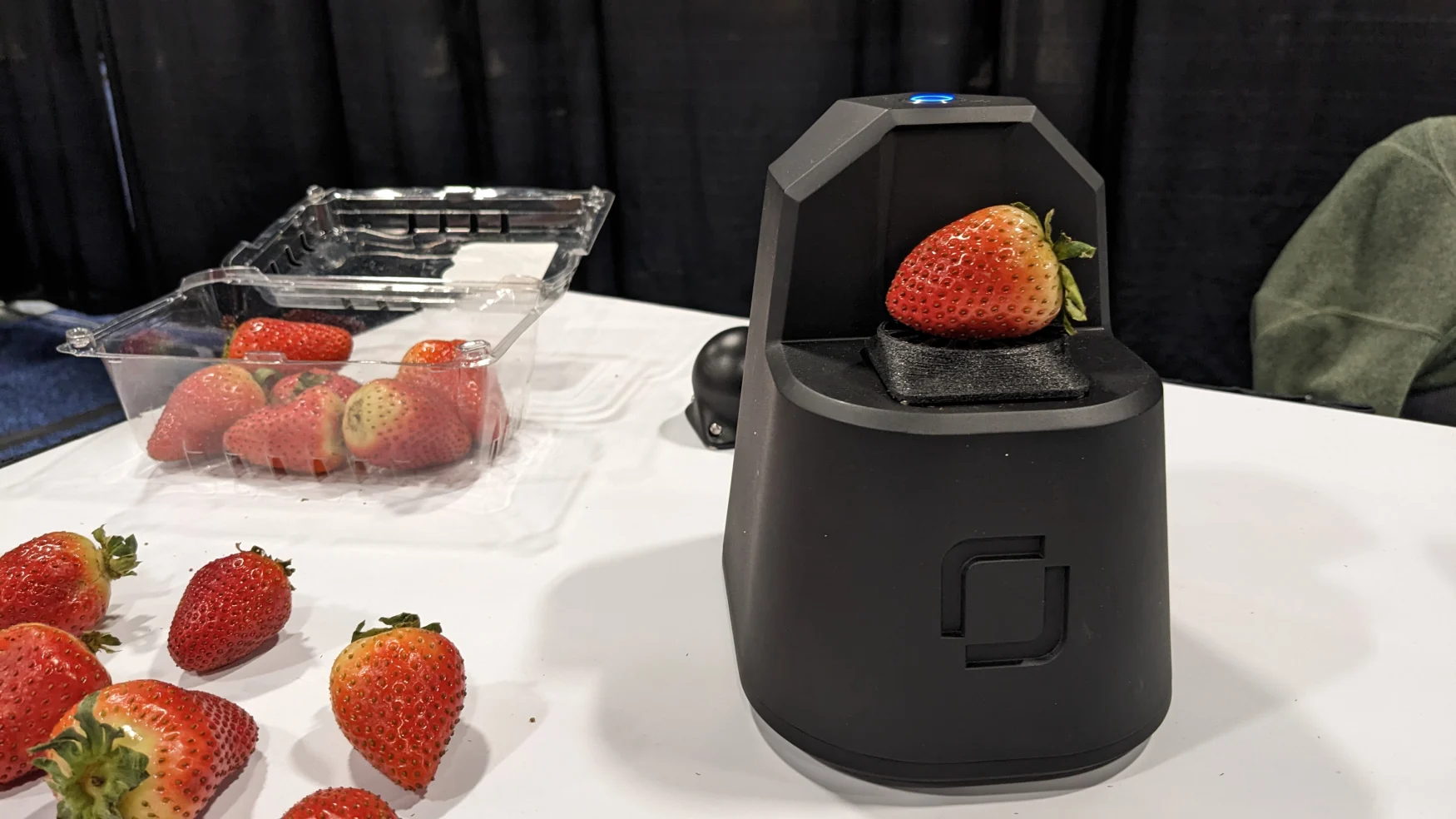 its a black box with a cradle for either strawberries or avocados that blasts a little red light at them and tells you if they're sufficiently squishy.
