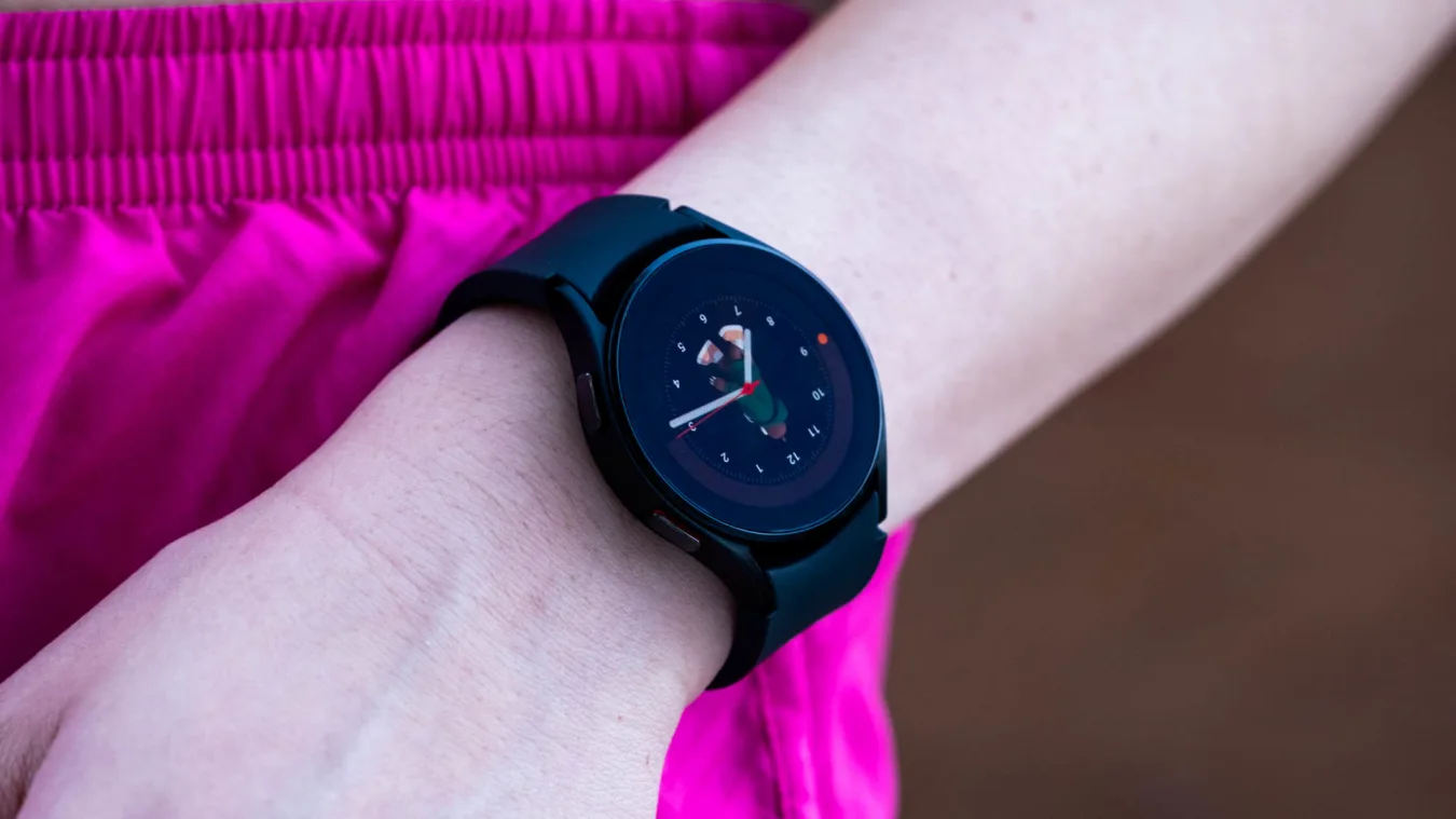 A black Samsung Galaxy Watch 4 on a wrist