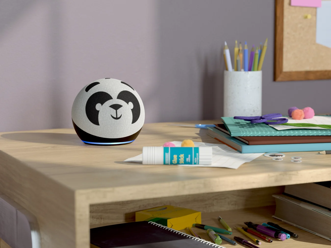 Panda Echo Dot on a table full of craft supplies