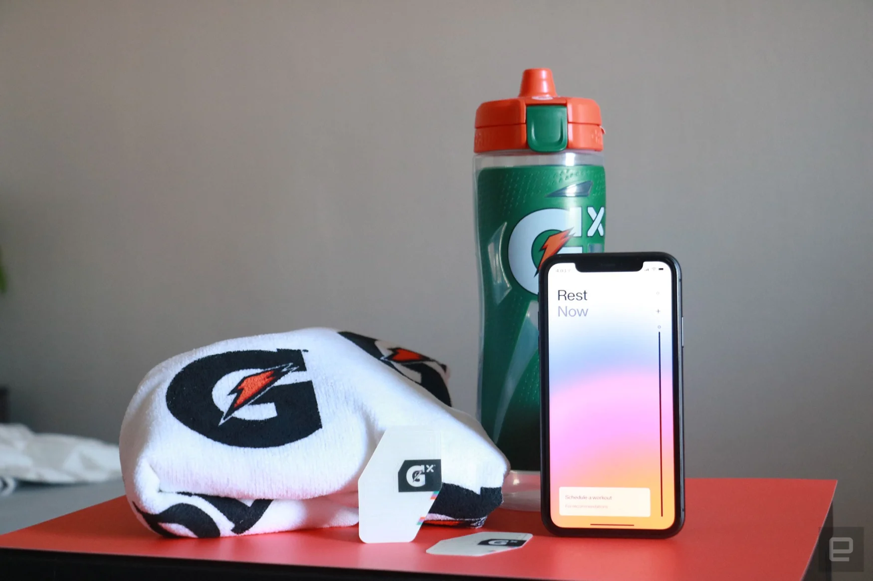 Gatorade Gx Sweat patch on a desk with Gatorade towel, bottle and an iPhone in the background