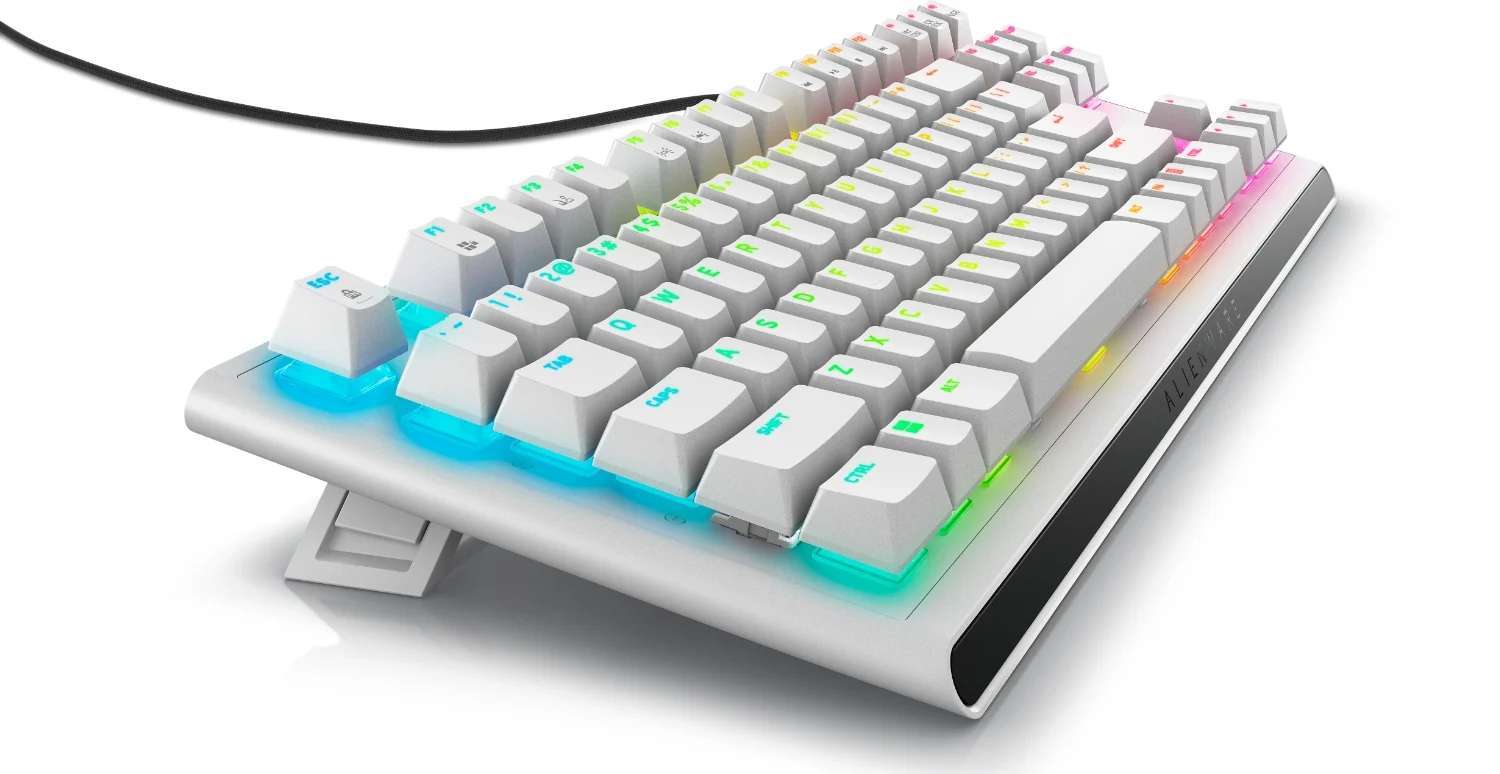 Product marketing image of the Alienware Tenkeyless Gaming Keyboard taken from the left side.  It has RGB lighting under its mechanical keys.  White background.
