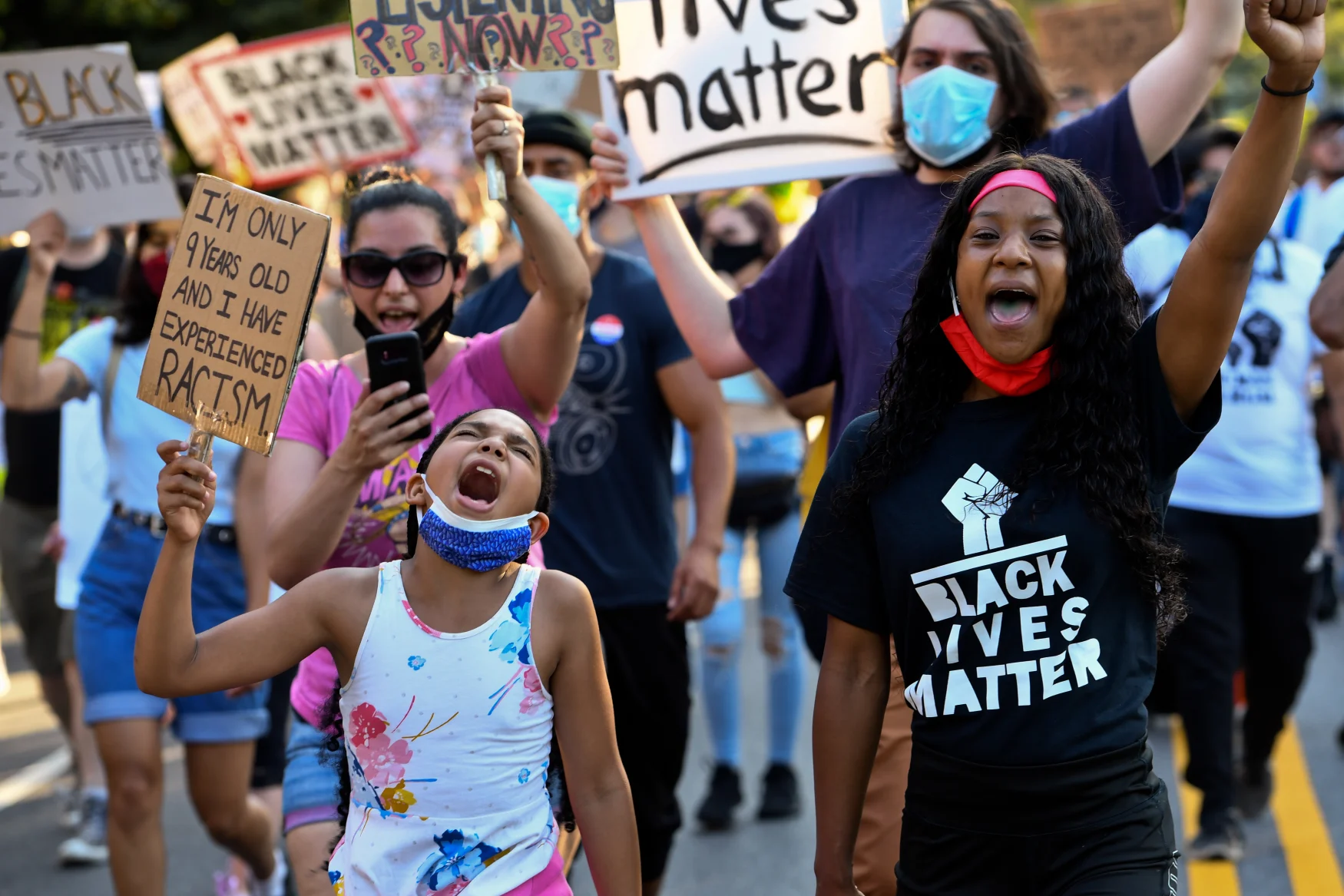 Garden City, N.Y.: Cristiana Gant, 9, of Rockville Centre, New York, left, shouts alongside fellow activists during a protest in Garden City against police brutality in the wake of the Death of George Floyd, on June 23, 2020. (Photo by Steve Pfost/Newsday RM via Getty Images)