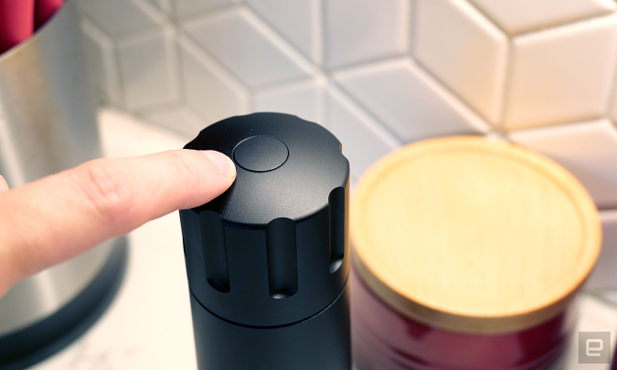 Refilling the pepper cannon is as easy as pressing down on its lone top button. 
