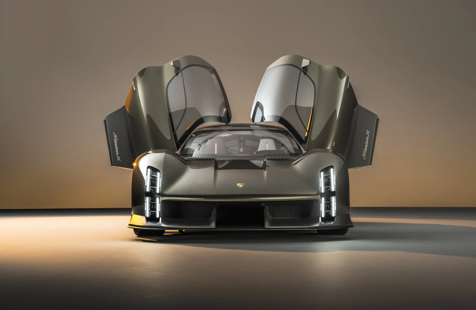 The Porsche Mission X electric car concept with its Le Mans-style doors open upwards.