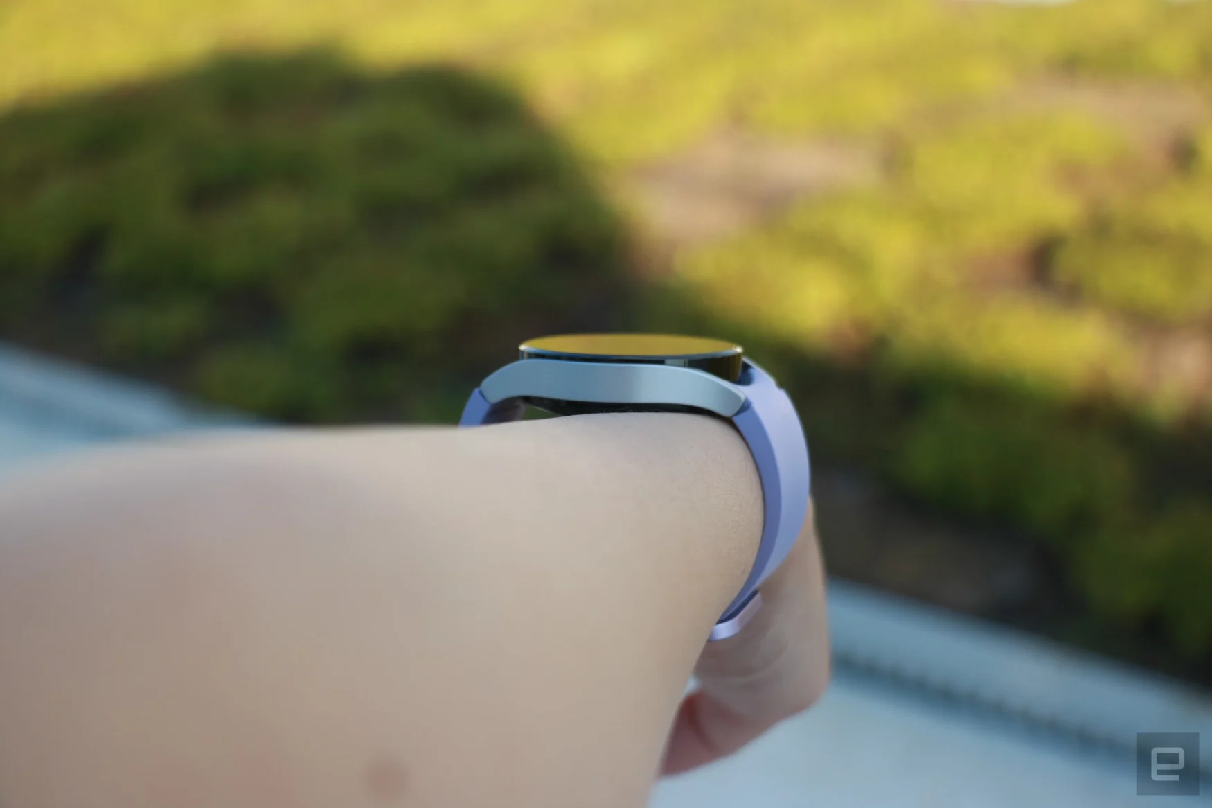 Side view of the Samsung Galaxy Watch 5 on a wrist, showing the left edge of the watch and how it hugs the wrist.