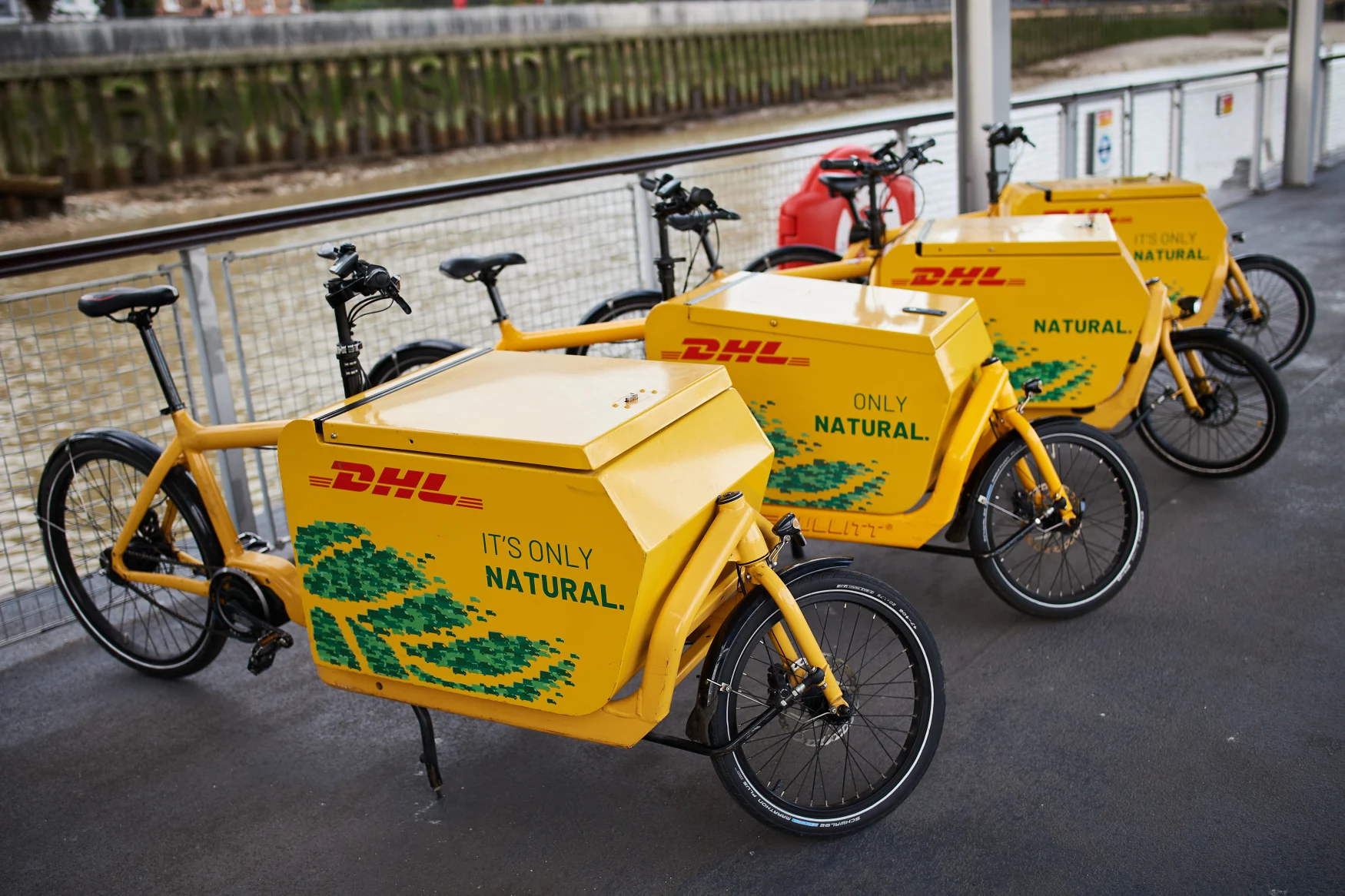 LONDON, ENGLAND - SEPTEMBER 28: A row of delivery bikes are seen as the DHL Riverboat makes its first postal delivery run from Wandsworth Pier to Bankside on September 28, 2020 in London, England. The riverboat parcel delivery service will run daily at 7:30am, with packages loaded onto the riverboat at Wandsworth Pier before travelling along the Thames into central London. The riverboat will then dock at Bankside for final-mile delivery on DHL courier bicycles. (Photo by Leon Neal/Getty Images)