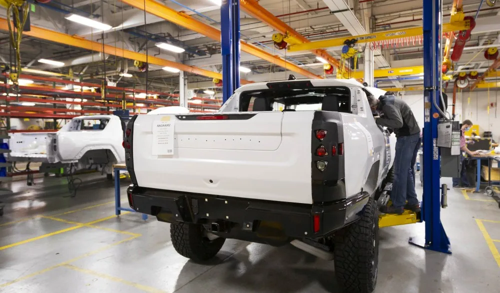 Two GMC HUMMER EVs completing their builds prior to shipping for continued validation testing. (Photo by Jeffrey Sauger for General Motors)