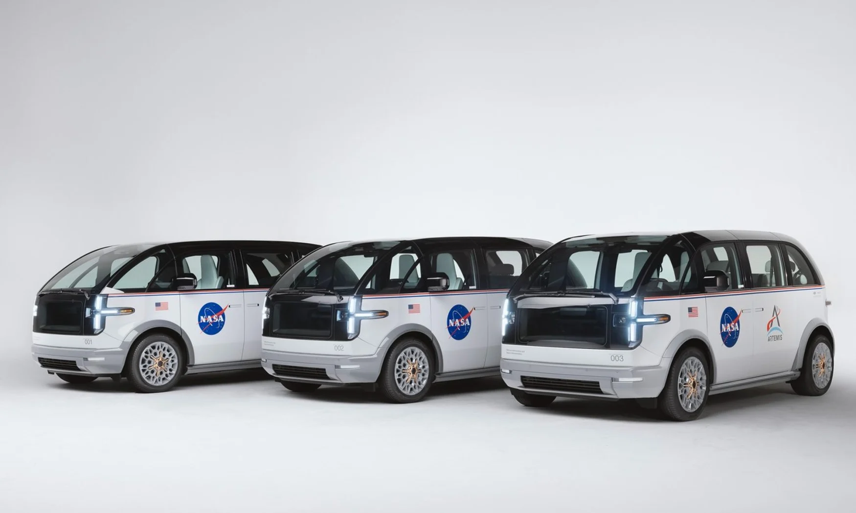 A group shot of Canoo's NASA vans. 
