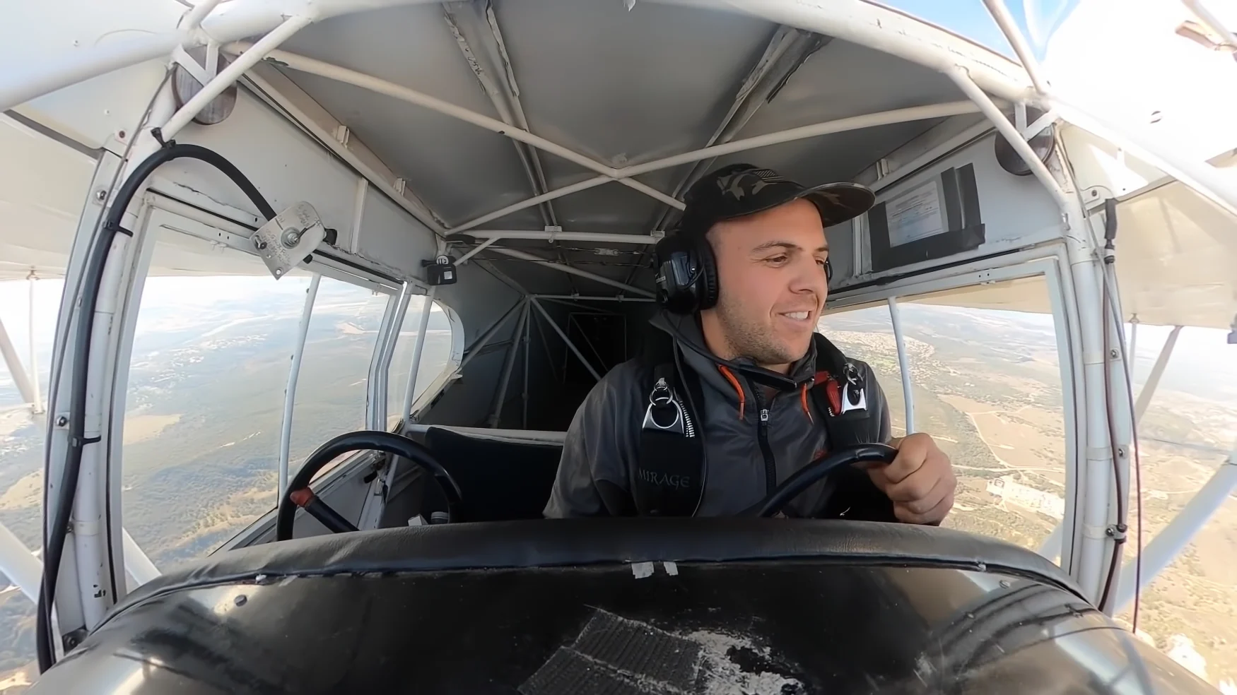 YouTuber Trevor Jacob flying in a small airplane. Cockpit-camera view from head-on.