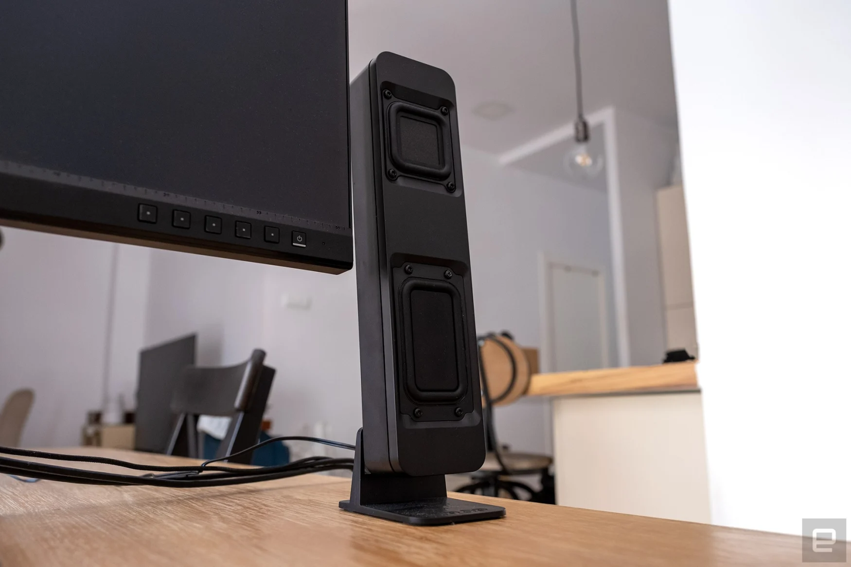 A Drop BMR1 speaker pictured next to a PC monitor.