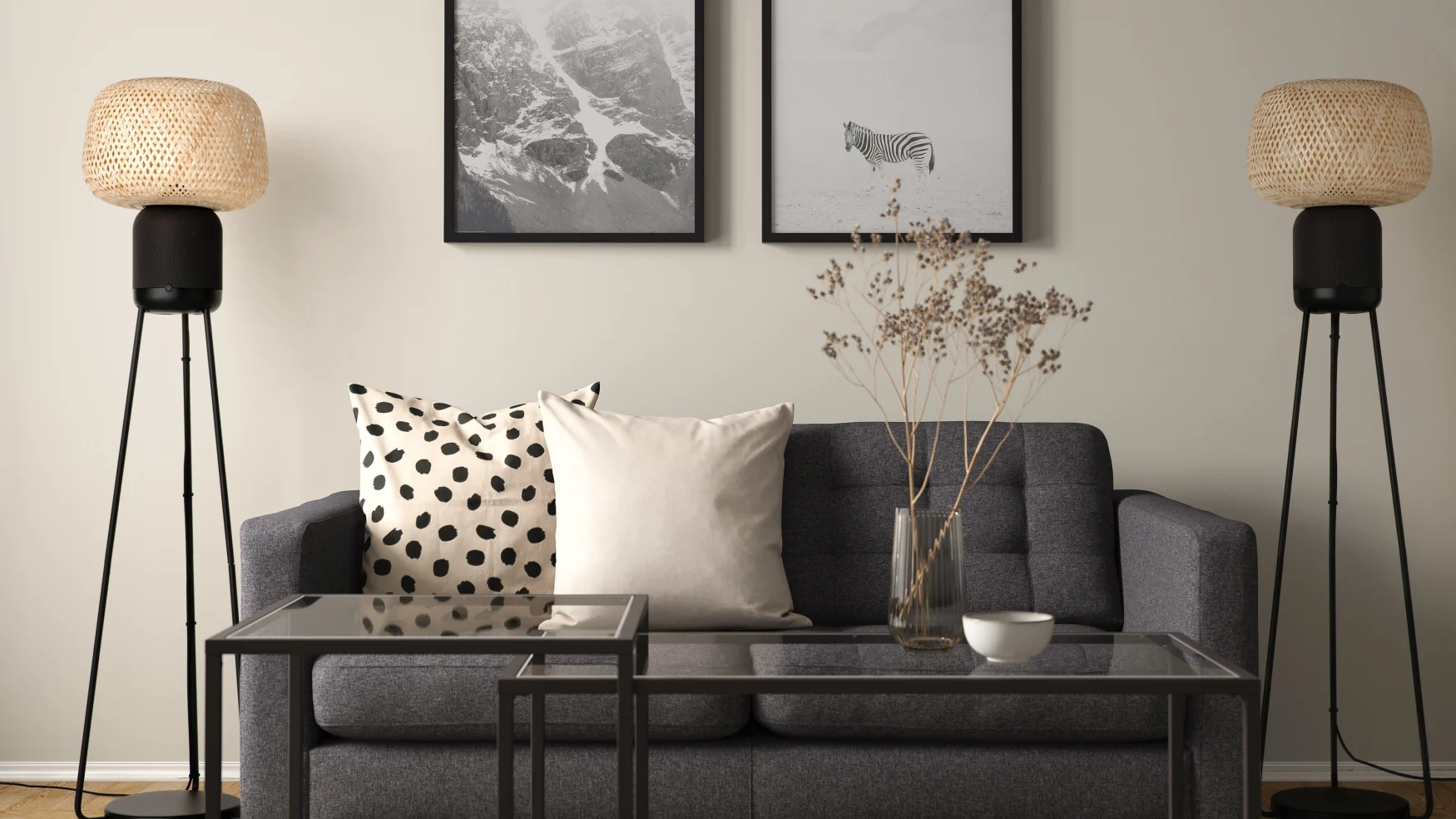 Two IKEA Symfonisk floor lamp speakers flanking a couch in a modern living room.
