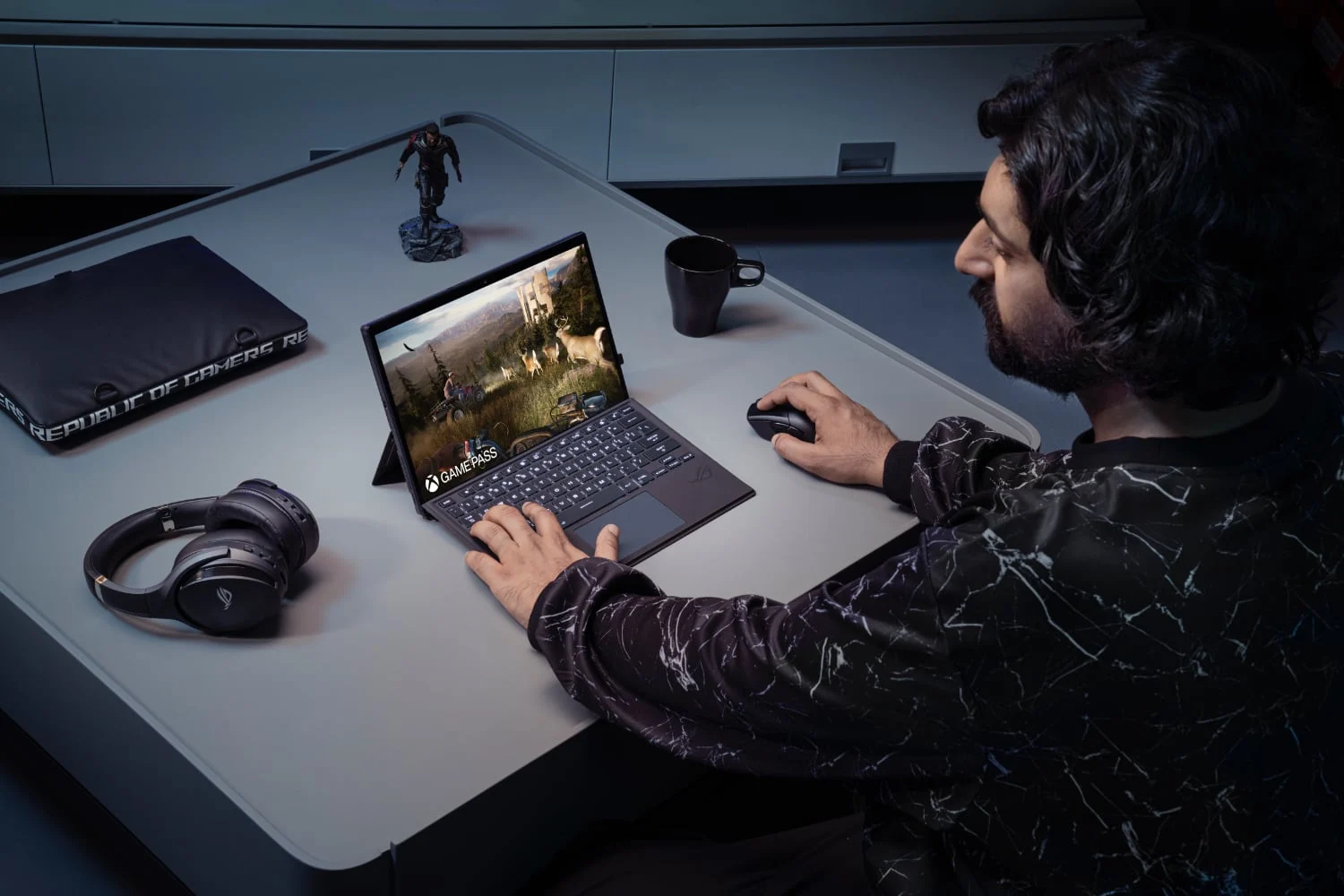 PR lifestyle photo of a man playing ASUS Flow Z13 Gaming 2-in-1.