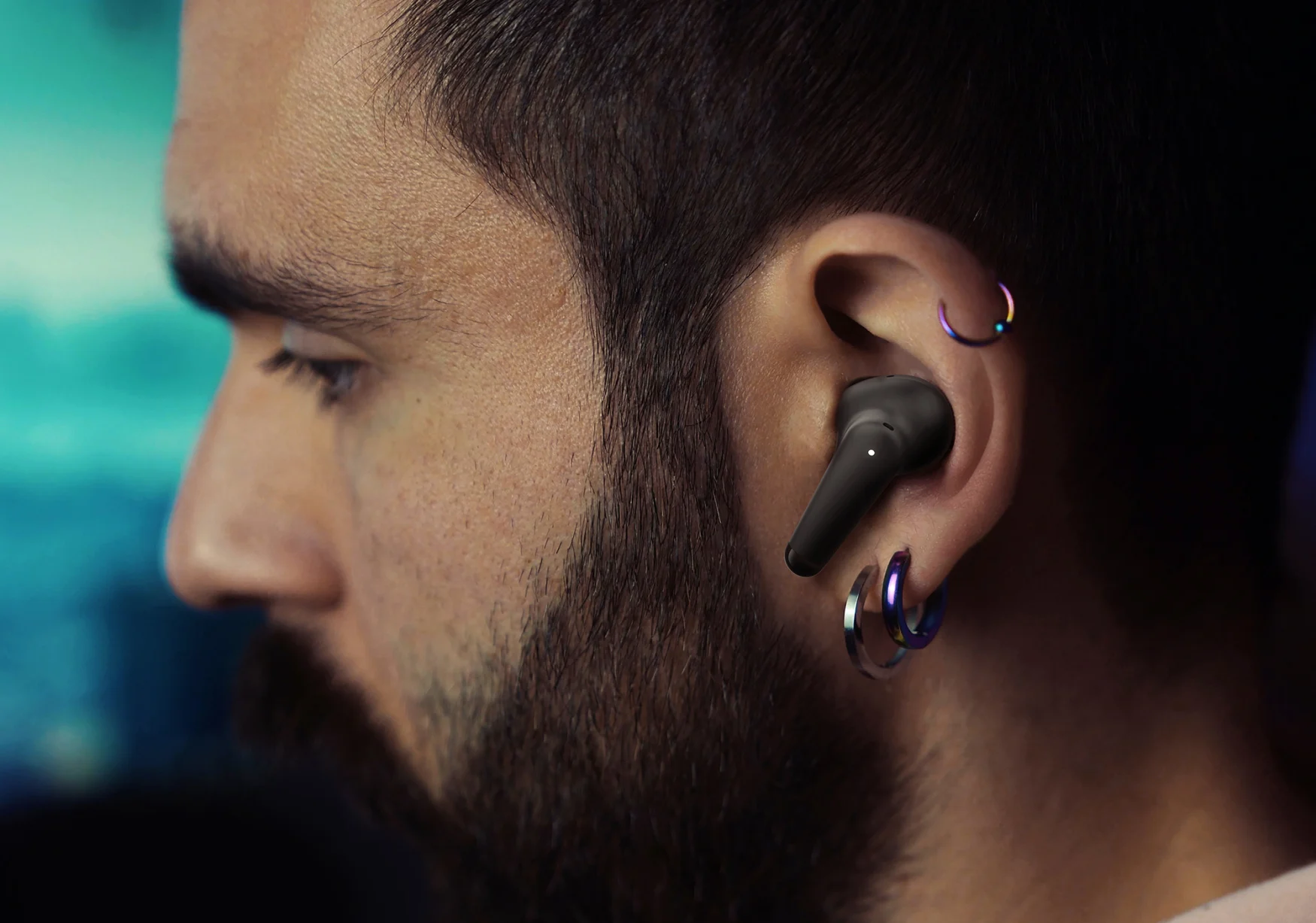 A person wearing a Palm Buds Pro earbud.