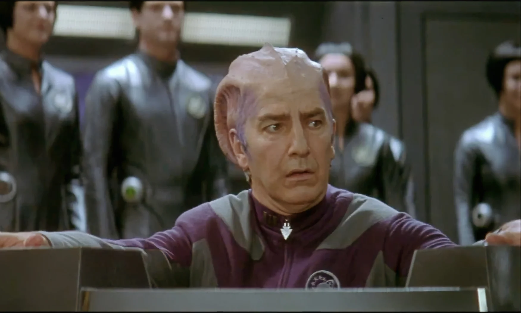 Still from the movie ‘Galaxy Quest’ (1999) featuring Alan Rickman in sci-fi makeup and costume.