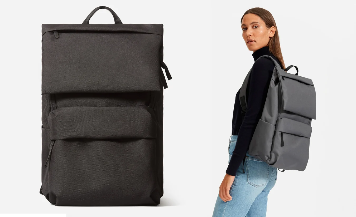 The Everlane Renew Transit backpack worn on one shoulder by a female model.