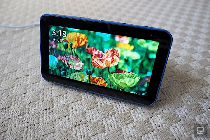 The Amazon Echo Show 5, photographed on a beige carpet.