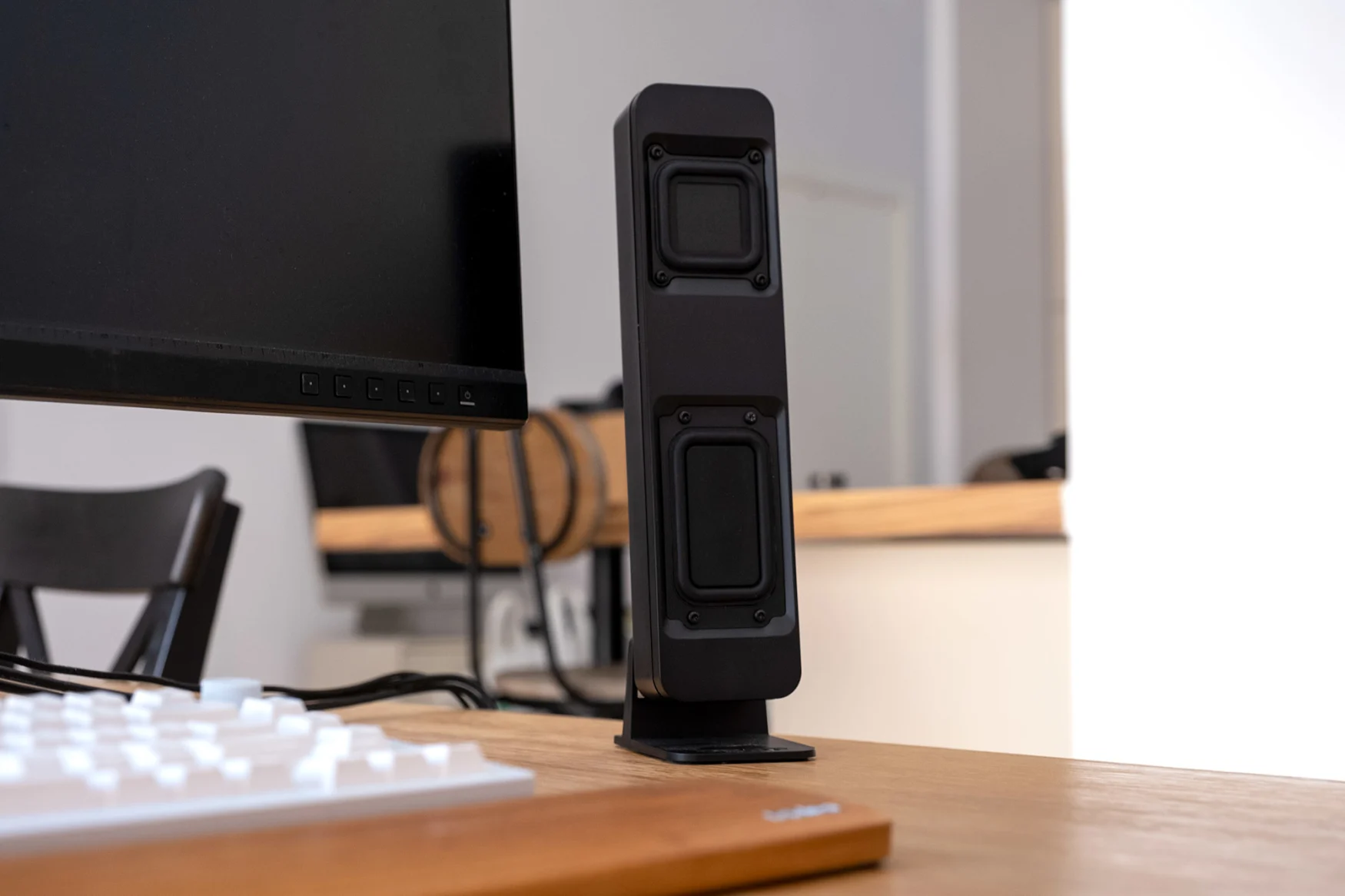 A Drop BMR1 speaker pictured on a desk next to a PC monitor and keyboard.