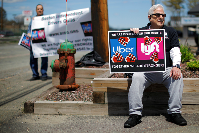 Uber and Lyft drivers protest during a day-long strike outside Uber’s office in Saugus, Massachusetts, U.S., May 8, 2019.   REUTERS/Brian Snyder