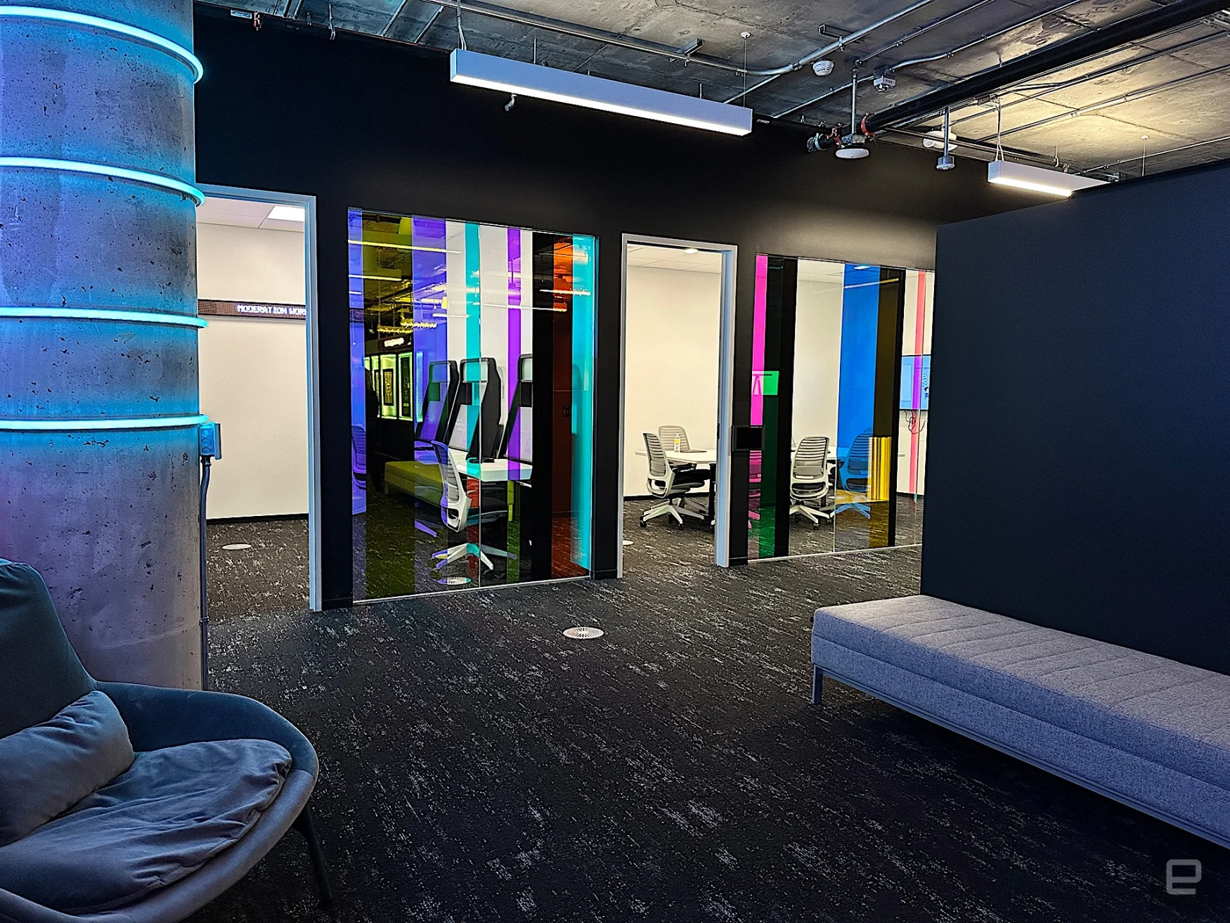 An interior shot of the TikTok Transparency and Accountability Center, a windowless office with rooms dedicated to the app's algorithm and content moderation systems.
