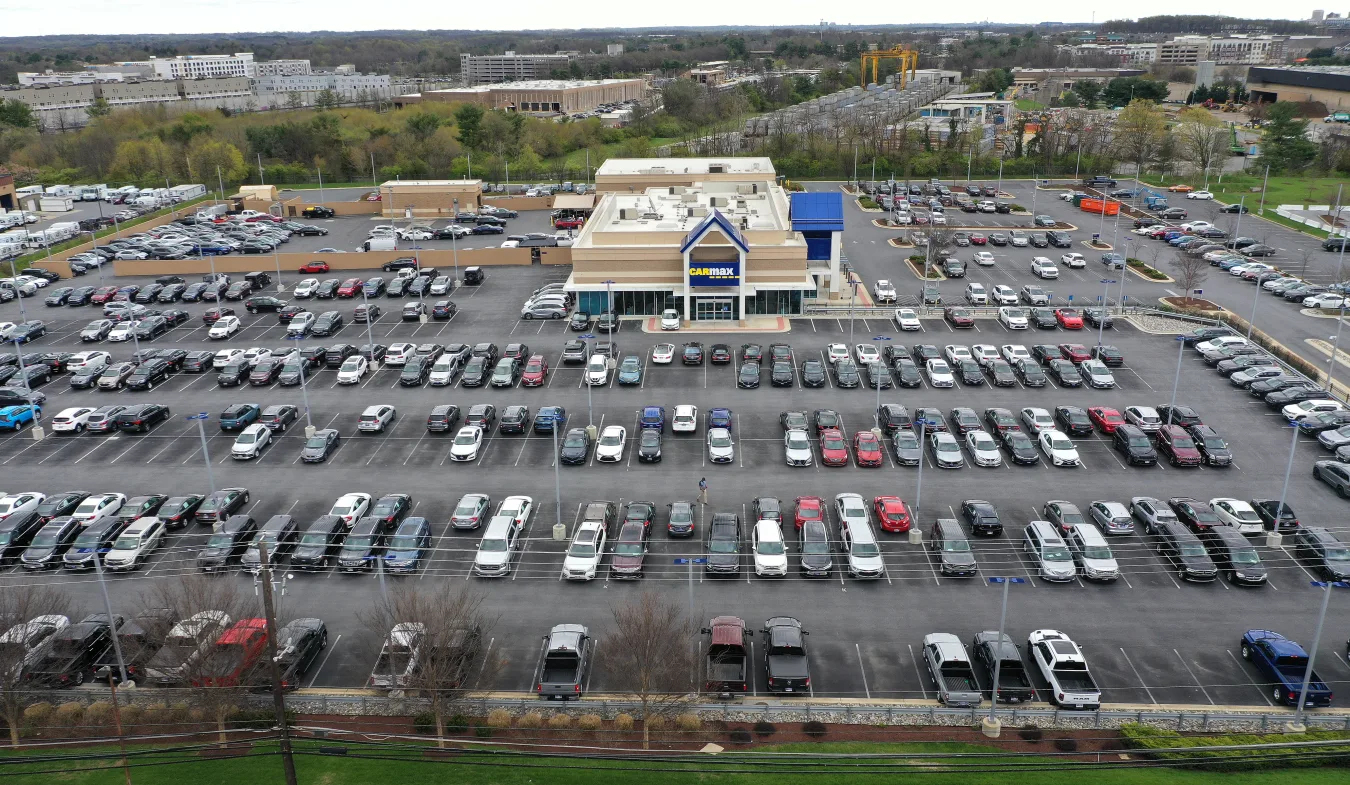 GAITHERSBURG, MARYLAND - APRIL 12:  In an aerial view, a CarMax lot holds hundreds of used cars and trucks on April 12, 2022 in Gaithersburg, Maryland. Consumer prices rose 8.5 percent in the year through March 2022, reaching the fastest inflation rate since 1981 with the U.S. average for a gallon of regular gas peaking at $4.33 on March 11.  (Photo by Chip Somodevilla/Getty Images)