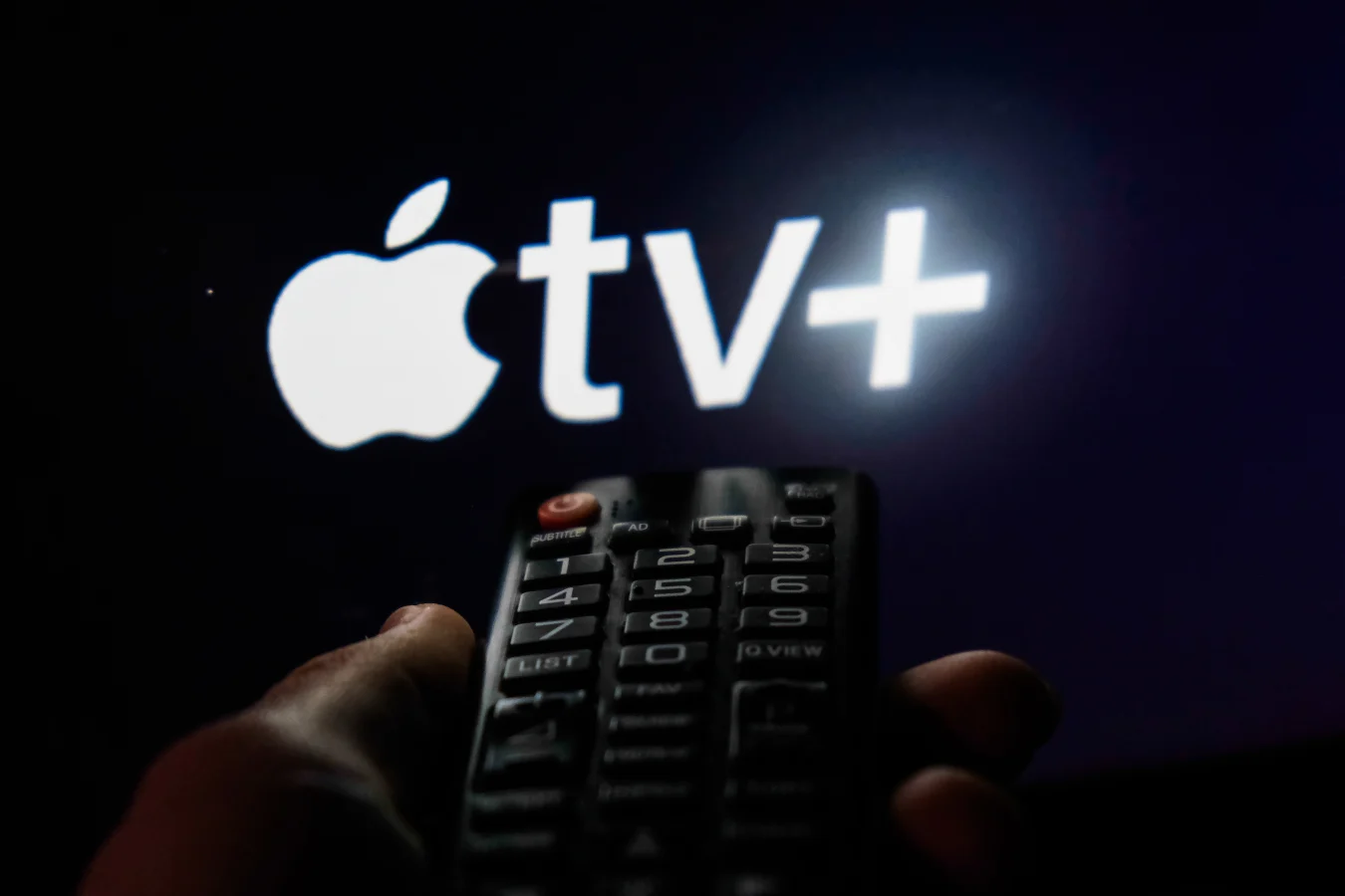 TV remote control is seen with Apple TV+ logo displayed on a screen in this illustration photo taken in Krakow, Poland on February 6, 2022. (Photo by Jakub Porzycki/NurPhoto via Getty Images)