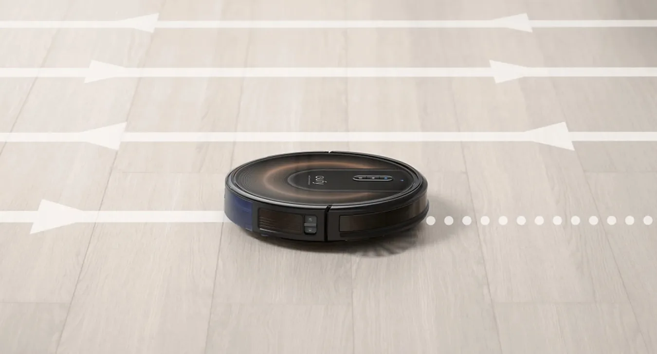 Anker's Eufy RoboVac G30 Edge robot vacuum with superimposed lines and arrows to show its travel path.