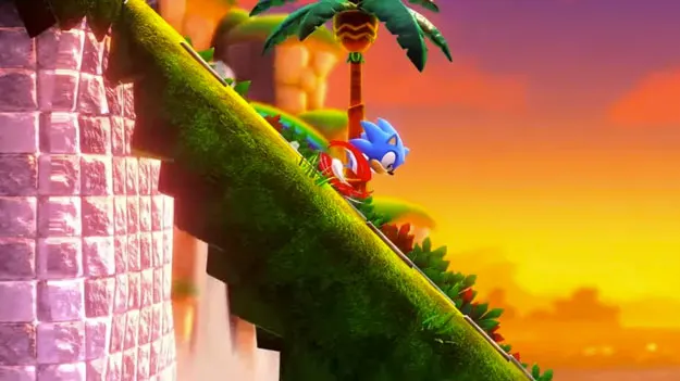 Sonic Superstars'tan Sonic'in yeniden düzenlenmiş Green Hill Zone'da keskin bir yokuştan aşağı yuvarlandığını gösteren ekran görüntüsü.