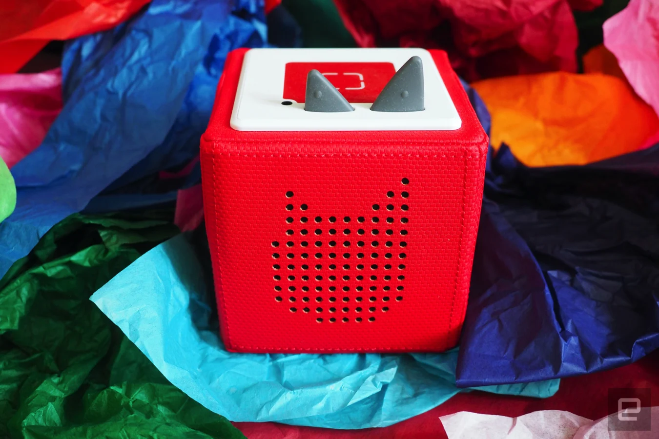 Red Toniebox on colored tissue paper