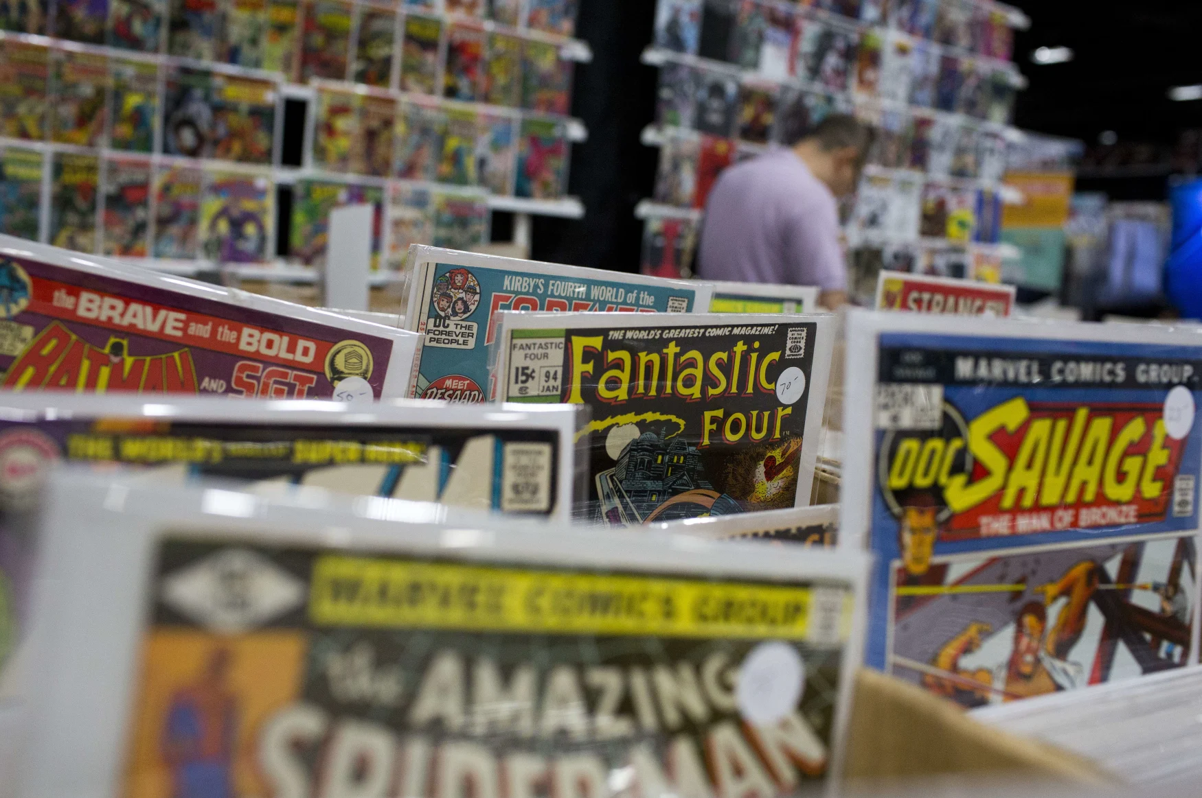 Comic books are displayed at the DC Awesomecon comic book convention in Washington, DC, on May 29, 2015. AFP PHOTO/ ANDREW CABALLERO-REYNOLDS        (Photo credit should read Andrew Caballero-Reynolds/AFP via Getty Images)