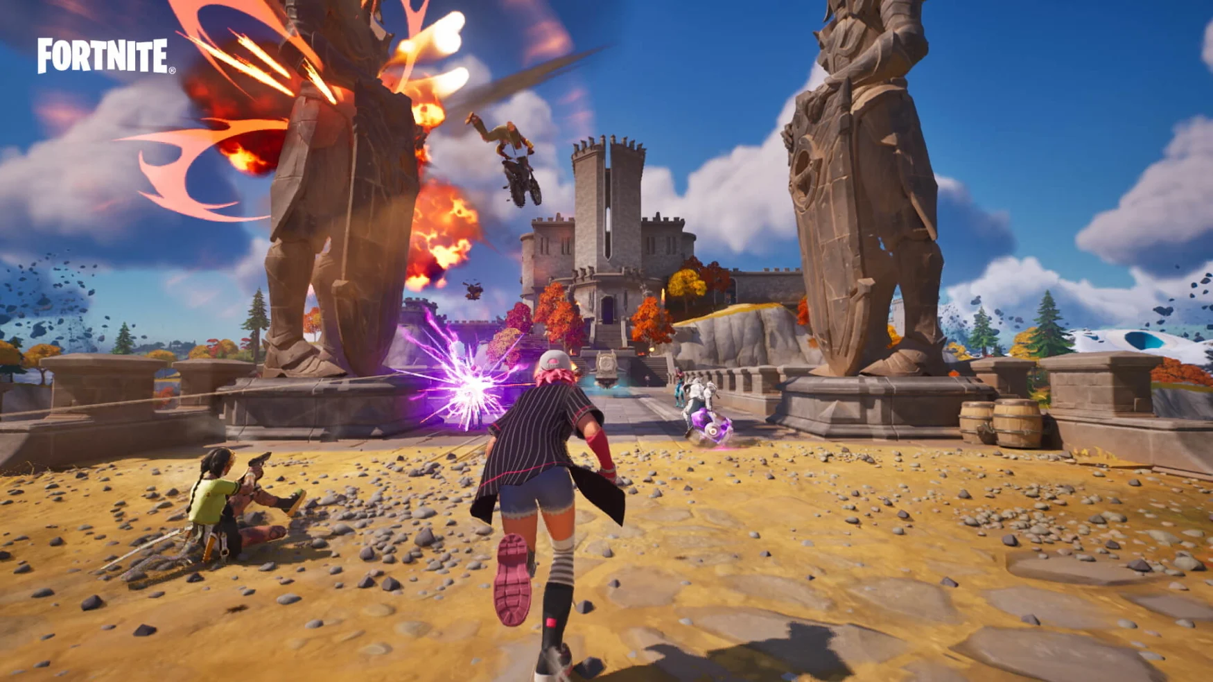 A character runs into battle in Fortnite as an explosion is set off to the side.