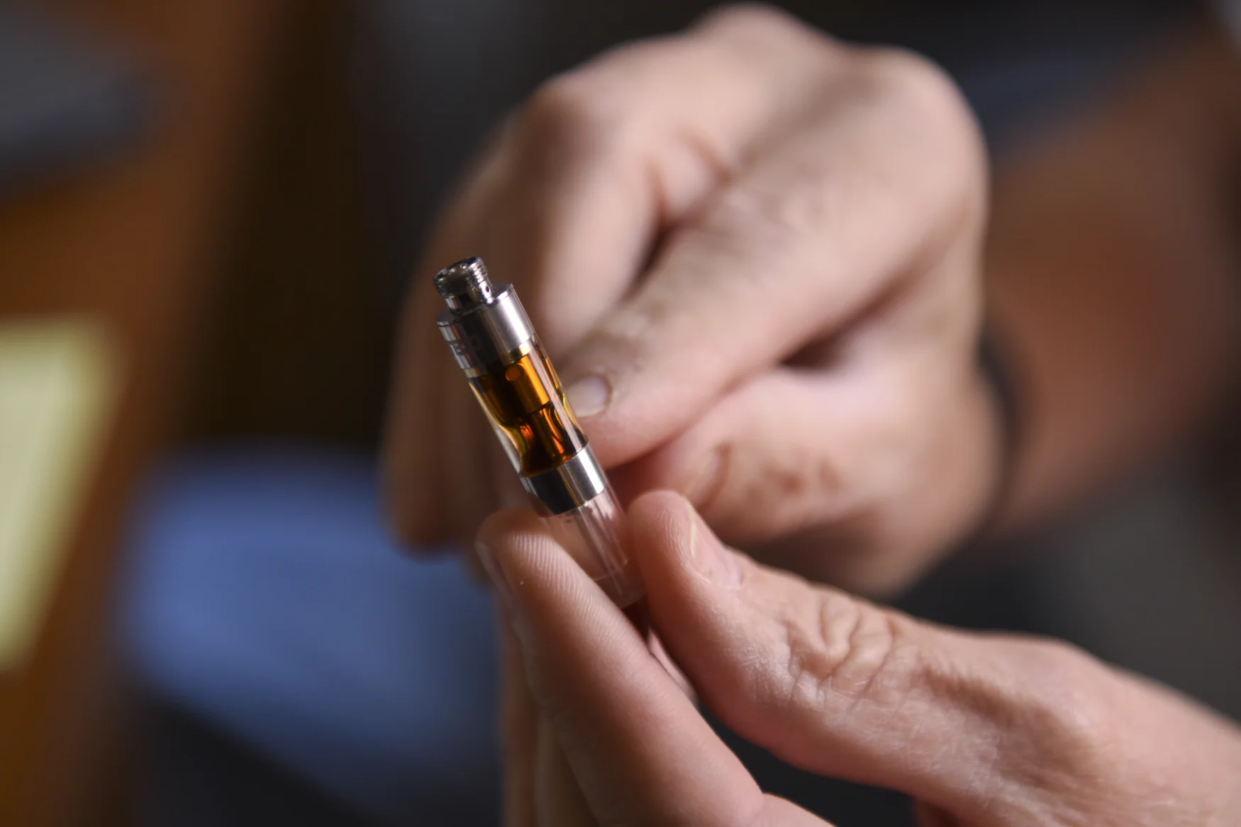 Ted Chase points the amount left in his medical marijuana vape cartridge. Photo by Lauren A. Little (Photo By Lauren A. Little/MediaNews Group/Reading Eagle via Getty Images)