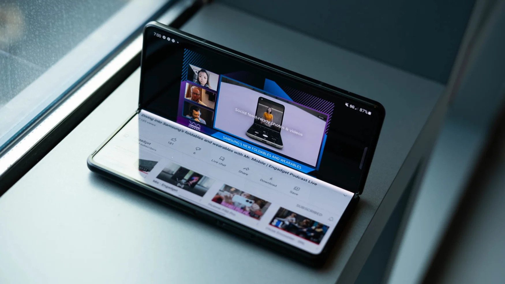 Watching a video with the Samsung Galaxy Z Fold 3 half bent and sitting up on a window ledge like a mini laptop.