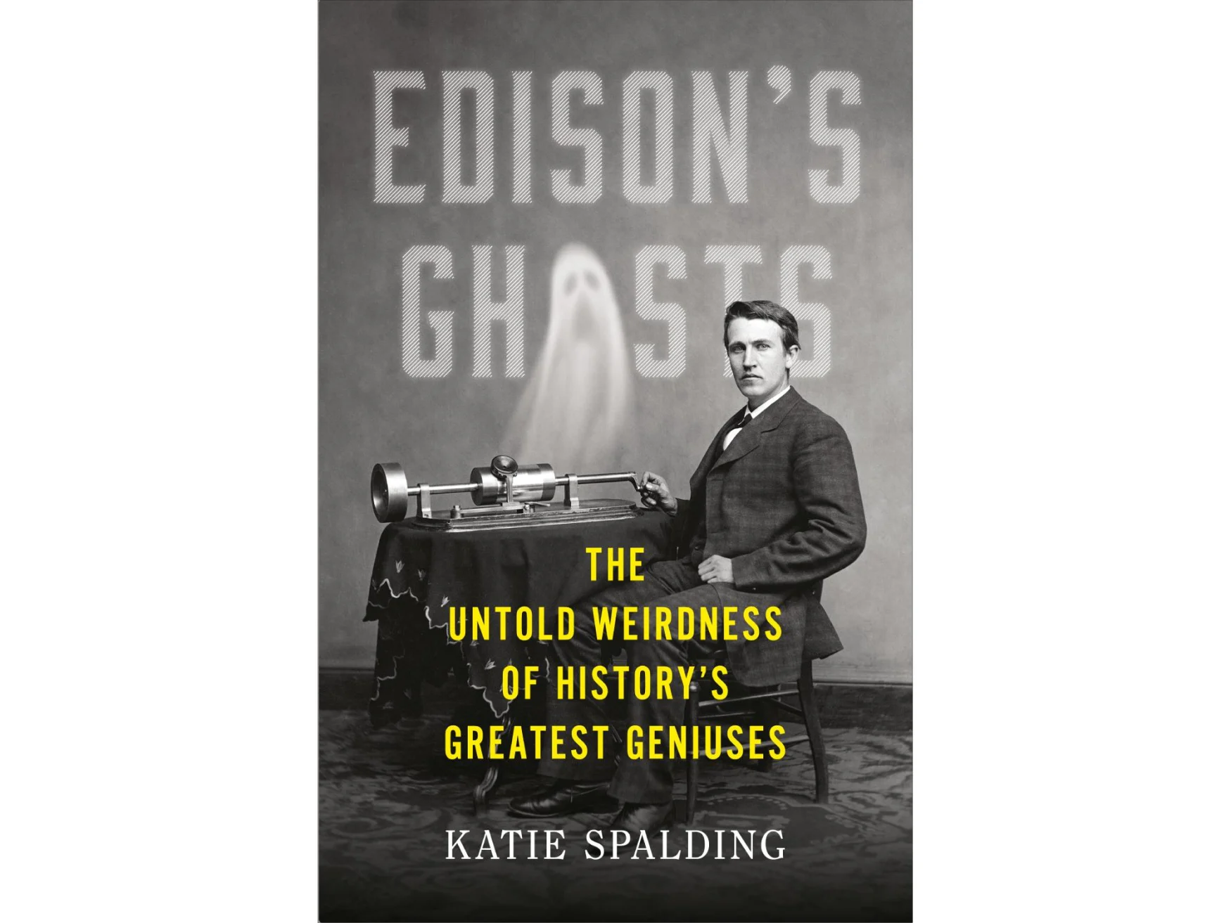 b&w image of Edison sitting at a desk with a device atop it, a ghost rising from the surface to form the O in Ghosts