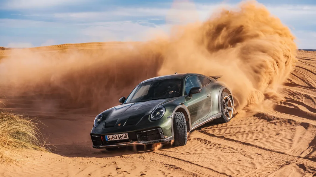 2023 Porsche 911 Dakar in Oak Green sliding on a dune