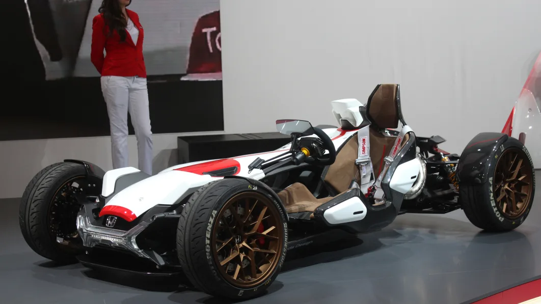 Honda Project 2 & 4 concept that combines the company's RC-213vs MotoGP bike with a car, at the 2015 Frankfurt Motor Show, low front three-quarter view.