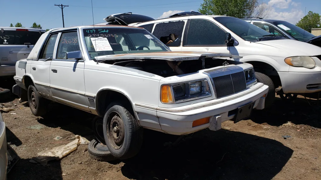 46 - 1988 Chrysler LeBaron in Colorado junkyard - photo by Murilee Martin