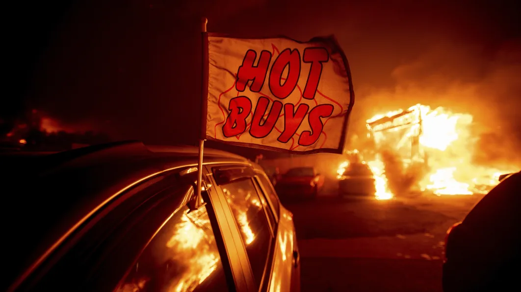 Flames consume a car dealership as the Camp Fire tears through Paradise, Calif., on Thursday, Nov. 8, 2018. Tens of thousands of people fled a fast-moving wildfire Thursday in Northern California, some clutching babies and pets as they abandoned vehicles and struck out on foot ahead of the flames that forced the evacuation of an entire town and destroyed hundreds of structures. (AP Photo/Noah Berger)