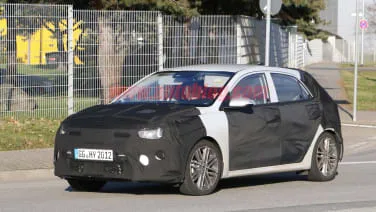 2021 Kia Rio spied with heavy camo, wearing a mid-cycle refresh