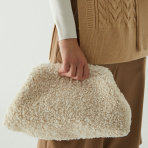 This season’s most wanted teddy clutch is finally back in stock